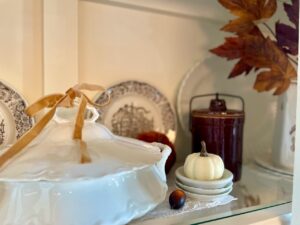 cozy fall hutch vignette with thrifted decor