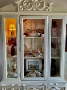 full fall hutch decor display with vintage and thrifted items