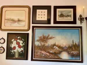 full gallery wall in living room thrift store finds