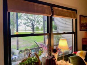 cordless Roman Shades styled in a vintage living room