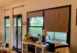 living room transformation with roman shades