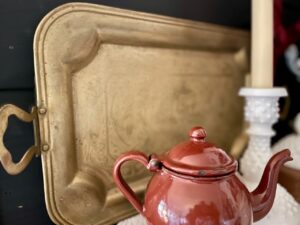 vintage brass tray styled on a mantel for fall