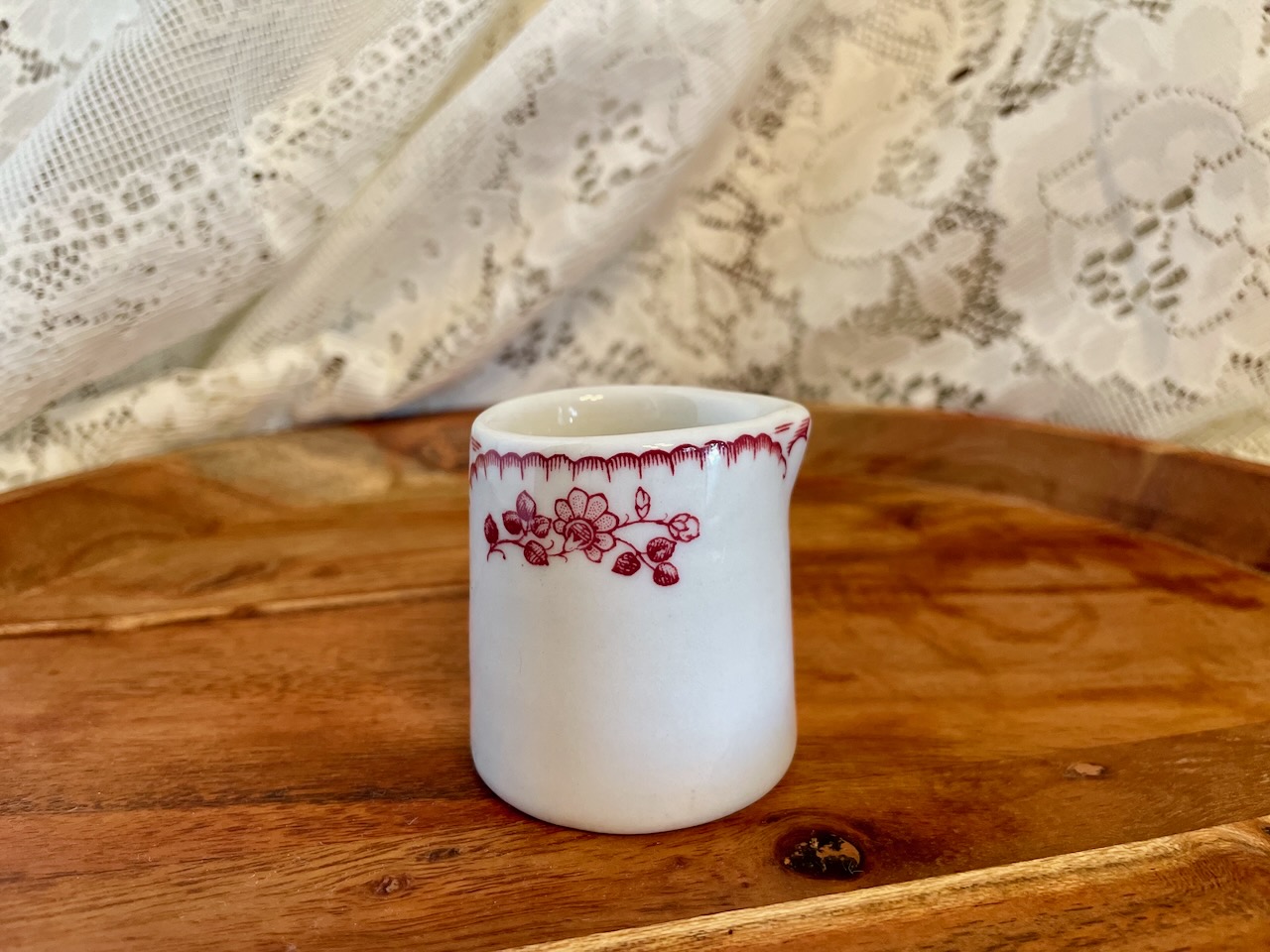 vintage shenango china creamer with red floral rim