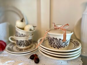 vintage brown transferware styled in a hutch for fall decor