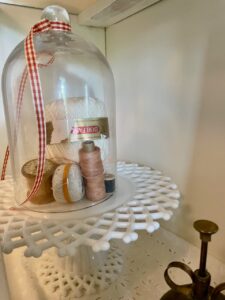 vintage decor styled in a hutch for fall