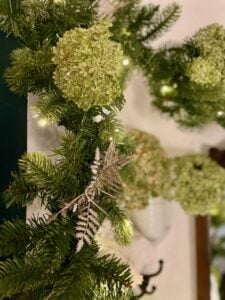 styling a pre-lit faux garland for Christmas