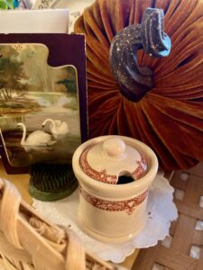 vintage decor items in a fall basket display