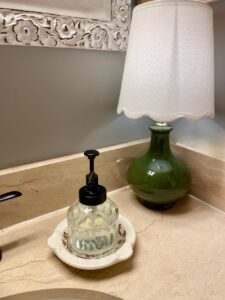 vintage ashtray used as a soap dish in a bathroom