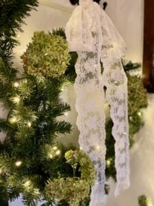 hanging a faux wreath in a small entryway for Christmas decor