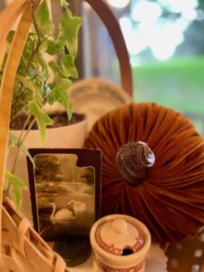 a basket styled with vintage fall decor